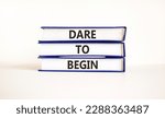 Small photo of Dare to begin symbol. Books with words 'Dare to begin'. Beautiful white background. Business, dare to begin concept, copy space.