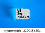Small photo of FTE Full time equivalent symbol. Concept words FTE Full time equivalent on beautiful white paper. Beautiful blue table blue background. Business and FTE Full time equivalent concept. Copy space.