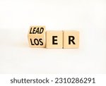 Small photo of Loser or leader symbol. Businessman turns wooden cubes and changes the word Loser to Leader. Beautiful white table white background. Business and loser or leader concept. Copy space.