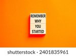 Small photo of Remember why you started symbol. Concept word Remember why you started on beautiful wooden block. Beautiful orange table orange background. Business remember why you started concept. Copy space.