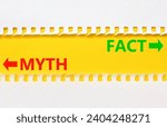 Small photo of Fact or myth symbol. Concept word Myth and Fact on beautiful yellow paper. Beautiful white paper background. Business and fact or myth concept. Copy space.