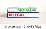 Small photo of Moral or legal symbol. Concept word Moral or Legal on beautiful books. Beautiful white table white background. Business and moral or legal concept. Copy space.