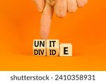 Small photo of Unite or divide symbol. Concept word Unite or Divide on wooden cubes. Beautiful orange table orange background. Businessman hand. Business unite or divide concept. Copy space.