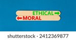 Small photo of Ethical or moral symbol. Concept word Ethical or Moral on beautiful wooden stick. Beautiful blue table blue background. Business and ethical or moral concept. Copy space.