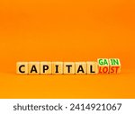 Small photo of Capital loss or gain symbol. Concept words Capital loss to Capital gain on beautiful wooden cubes. Beautiful orange table orange background. Business and capital loss or gain concept. Copy space.