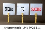Small photo of Exceed to succeed symbol. Concept words Exceed to succeed on beautiful white paper on clothespin. Beautiful grey table grey background. Business and exceed to succeed concept. Copy space.