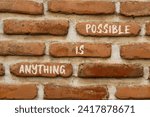 Small photo of Anything is possible symbol. Concept words Anything is possible on beautiful brown brick. Beautiful brown brick wall background. Business anything is possible concept. Copy space.