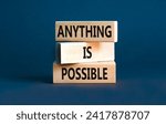 Small photo of Anything is possible symbol. Concept words Anything is possible on beautiful wooden blocks. Beautiful grey table grey background. Business anything possible concept. Copy space.