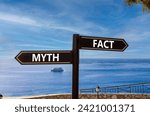 Small photo of Fact or myth symbol. Concept word Myth and Fact on beautiful signpost with two arrows. Beautiful blue sea sky with clouds background. Business and fact or myth concept. Copy space.