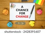 Small photo of A chance for change symbol. Concept words A chance for change on beautiful white note. Beautiful wooden table background. Colored paper. Black pen. Business A chance for change concept. Copy space.