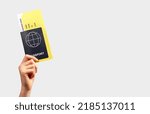 Small photo of Banner with hand holding passport and boarding pass. Air travel concept. Documents necessary for flying. Place for text High quality photo