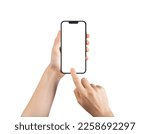 Small photo of Lodz, Poland February 05 2023 Mobile phone screen mock-up, blank smartphone in hand with finger clicking tapping on display isolated on white background. High quality photo