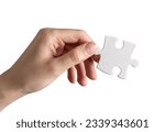 Hand holding puzzle piece ...