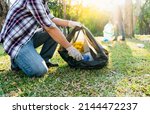 Small photo of Collecting the garbage and separating waste to freshen the problem of environmental pollution and global warming, plastic waste, care for nature. Volunteer concept of men carrying garbage bags
