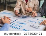 Small photo of Bookkeeper accountant or financial expert, male economist accounting money with statistics graphs pointing on the accounts for investment results and income Company expenditure