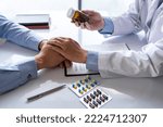 Small photo of Friendly male doctor hands holding patient hand sitting at the desk for encouragement, empathy, cheering, and support while medical examination. Bad news lessening, medicine, and health care concept