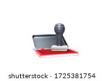 Small photo of Stamper and red stamp pad on white isolated background