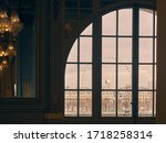 window through which you look at a Paris ferris wheel