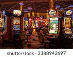 Small photo of Las Vegas, NV, USA - August 6, 2023: Gaming machines at a casino hotel in Las Vegas.