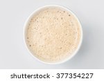 top view of paper cup takeaway mix latte coffee foam, white background