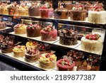 Small photo of Assorted fancy cakes in a shop-window