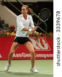 Small photo of Meghann Shaughnessy in action in the doubles vs Kirilenko/Hingis at Qatar Total Open, March 2, 2007.