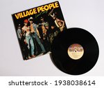 Small photo of Miami, FL, USA: March 17, 2021: Disco, funk, and soul band, the Village People music album on vinyl record LP disc. Titled: Live and Sleazy album cover