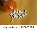 Small photo of Miami, FL, USA: April 2021: Buspirone HCL pills laying flat on a yellow background. This medication is used to treat anxiety. It may also help you feel less jittery and irritable and may control