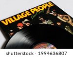 Small photo of Miami, FL, USA: June 2021: Disco, funk, and soul band, the Village People music album on vinyl record LP disc. Titled: Live and Sleazy album cover