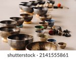 Small photo of A close-up of a Tibetan singing bowl - Translation of mantras: Transform your impure body, speech and mind into a pure exalted body, speech and mind of a Buddha.