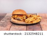 Small photo of A hamburger is a sandwich made from ground meat or vegetable origin, agglutinated in the form of a fillet cooked on the grill or grill, although it can also be fried or baked.
