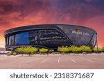 Small photo of Las Vegas, Nevada USA - 5 15 2023: A gorgeous spring landscape at Allegiant Stadium surrounded by lush green trees and plants and powerful clouds at sunset in Las Vegas Nevada USA