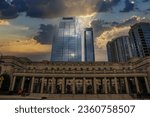 Small photo of Nashville, Tennessee USA - 11 28 2021: the Nashville Symphony Schermerhorn Symphony Center and the The Pinnacle at Symphony Place with powerful clouds at sunset in Nashville Tennessee USA