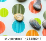 a group of smooth stones on the ... | Shutterstock . vector #415358047