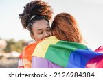 Lesbian couple hugging together ...