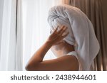 Young woman with head towel after morning shower 