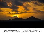 Mountain peaks at sunset sky. Sunset mountain peaks landscape. Mountain peaks at sunset sky