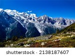 Mountain peaks and slopes on blue sky background. Mountain snowy peaks. Mountain snow on blue sky background. Mountain scene
