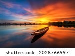 Lake Boat At Orange Sunset....