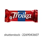 Small photo of WARSAW, POLAND - FEBRUARY 20, 2023: Norwegian chocolate candy bar Nidar Troika Trippel Nytelse (Triple Pleasure) in colorful red packaging isolated on white background