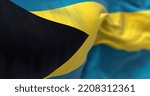 Small photo of Close-up view of the Bahamas national flag waving in the wind. The Commonwealth of the Bahamas is a country within the Lucayan Archipelago. Fabric textured background. Selective focus