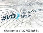 Small photo of Santa Clara, USA, March 2023: Broken glass with the Silicon Valley Bank logo blurred in the background. Bank run and bankruptcy. Finance and economy. Illustrative editorial
