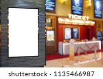 blank showcase billboard or advertising light box for your text message or media content with blurred image of ticket sales counter at movie theater, advertisement, marketing, entertainment concept
