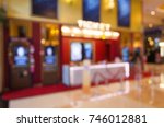 blurred image of ticket sale counter at movie theater