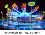 Blurred Amusement park ride at night. conceptual image of entertainment & fun