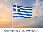 Greece flag waving on sundown...