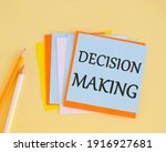 Decision making handwritten on a colofrful sticker. Concept of the action or process of making important decisions