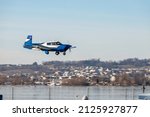 Small photo of Wangen-Lachen, Switzerland, February 13, 2022 Mooney M20 aircraft approaching a small airfield