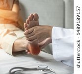 Small photo of Plantar Fasciitis or heel pain illness in feet of woman patient who having medical exam with orthopaedic doctor on aching tendon, inflammation or disorder of the connective tissue on foot and toe