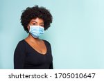 young black model wearing protective mask and black shirt and black power hair